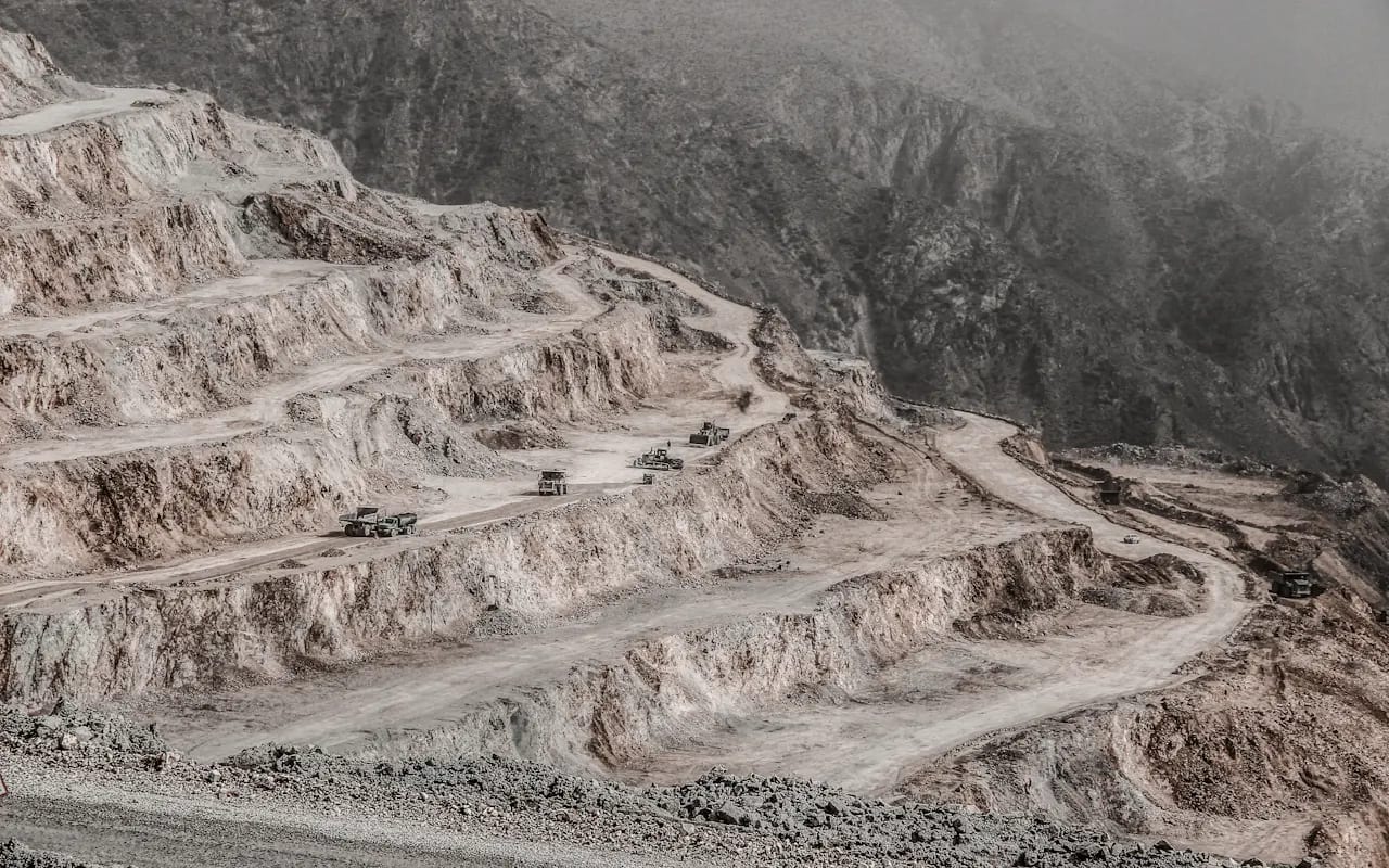 AI & IoT Rockfall Prediction — Benched slopes and haul roads — the setting the sensors cover.