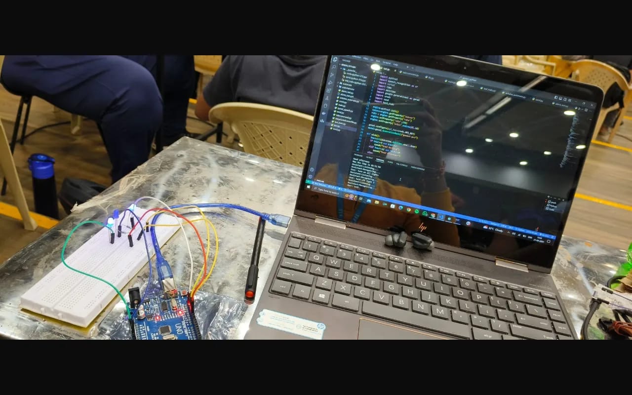 IoT Smart Home Automation — The build on the table — board and breadboard wired to the host running the parser.